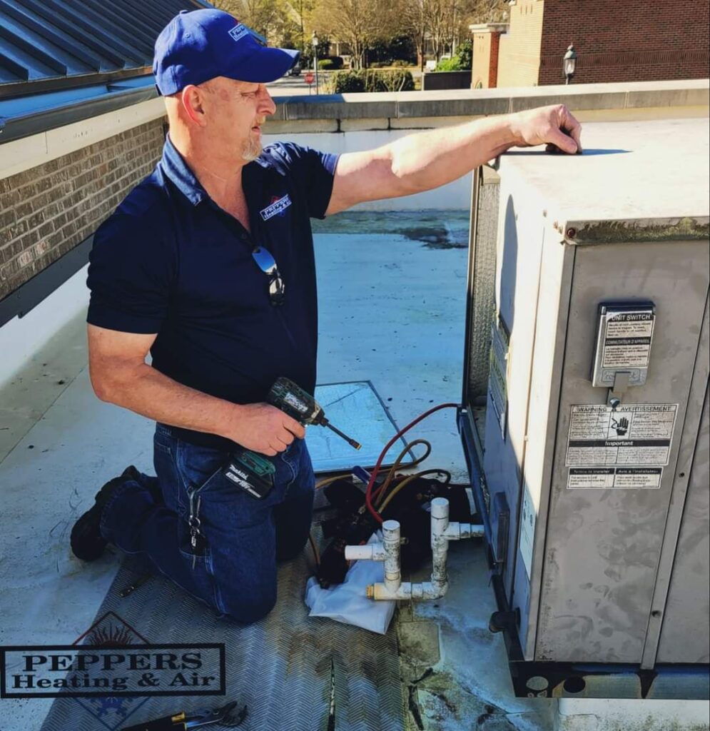 Peppers HVAC Tech Working on Roof